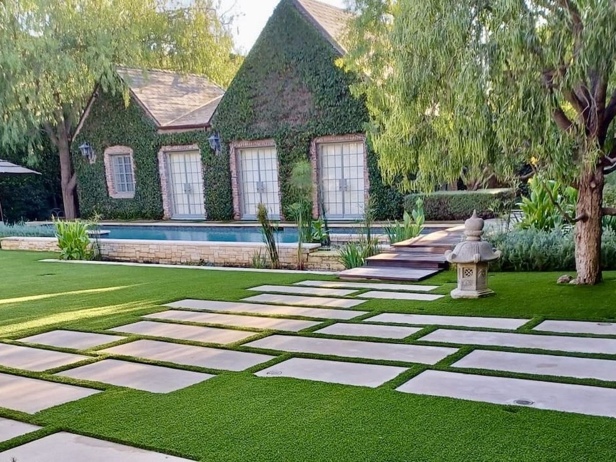 Artificial turf lawn with paver stepping stones in the Portland metro